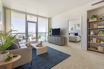 a living room with a couch and a tv at Vue, San Pedro, CA